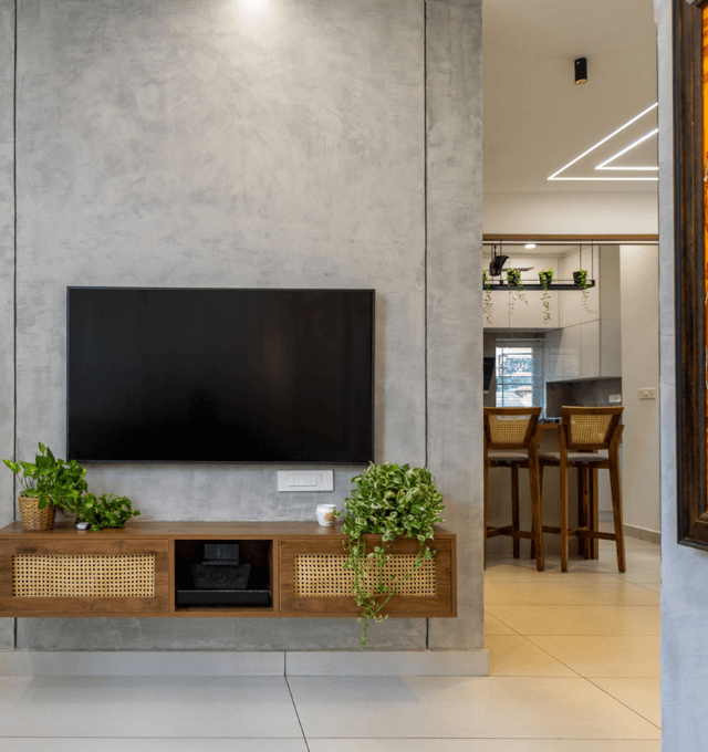 A contemporary living room featuring a wall-mounted television.